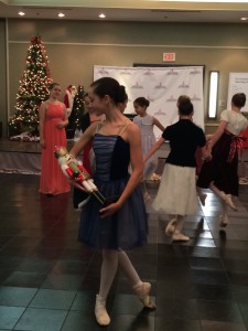 Mikaley Bolden, as Clara, dancing with her nutcracker.